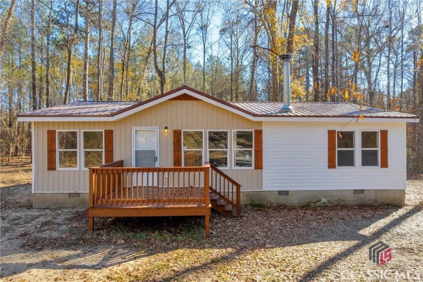 This beautifully renovated three bedroom two bathroom home - Beach Home for sale in Eatonton, Georgia on Beachhouse.com