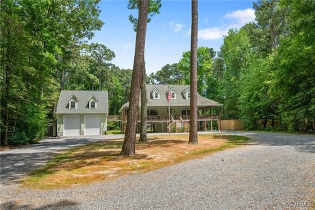 Welcome to your dream waterfront retreat! This custom-crafted - Beach Home for sale in Port Haywood, Virginia on Beachhouse.com