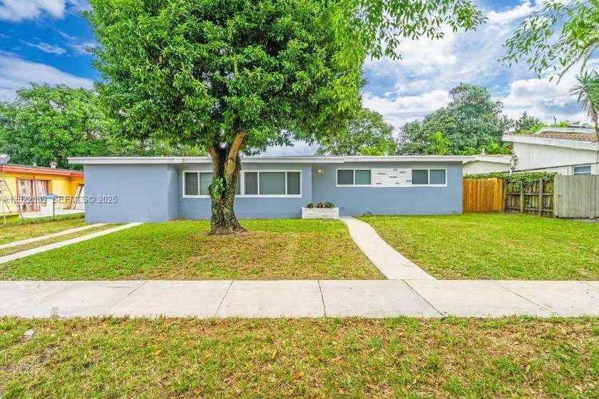 Welcome to this beautifully furnished 3-bedroom, 2-bathroom plus - Beach Home for sale in Miami, Florida on Beachhouse.com