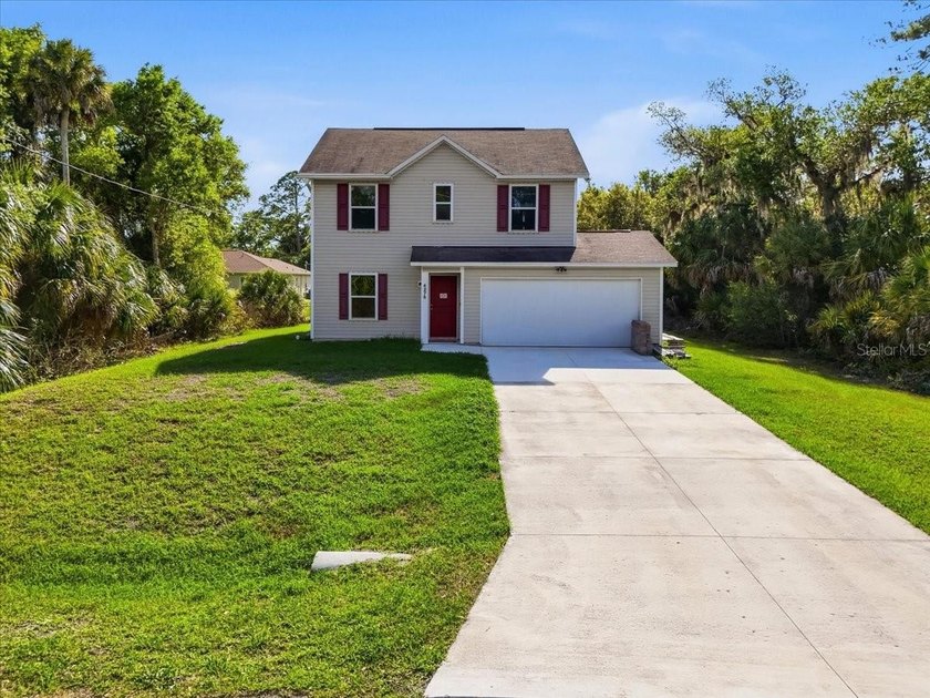 Welcome to this beautiful two-story home nestled in a peaceful - Beach Home for sale in North Port, Florida on Beachhouse.com