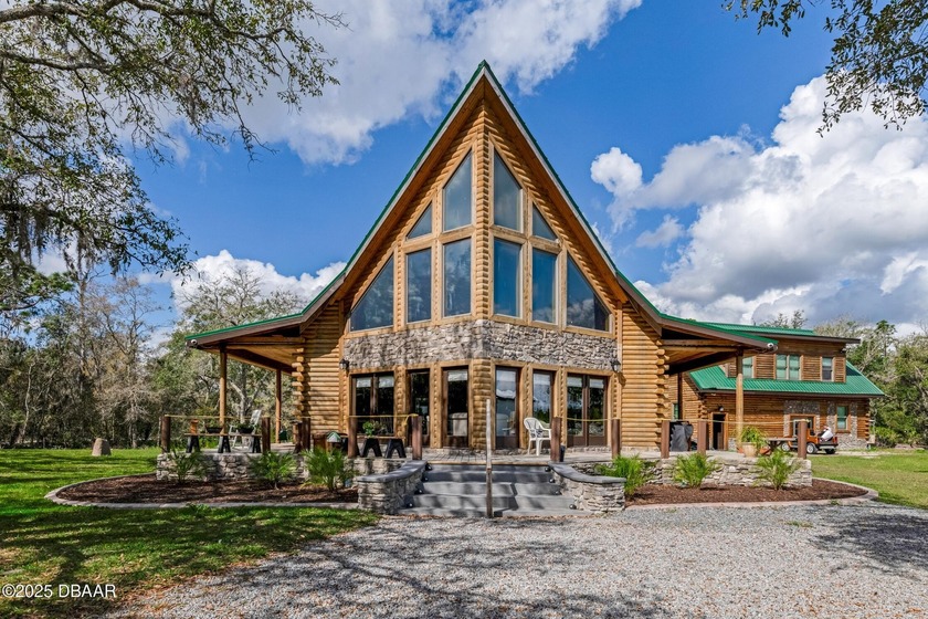 Breathtaking 3-story log cabin on a sprawling countryside estate - Beach Home for sale in New Smyrna Beach, Florida on Beachhouse.com
