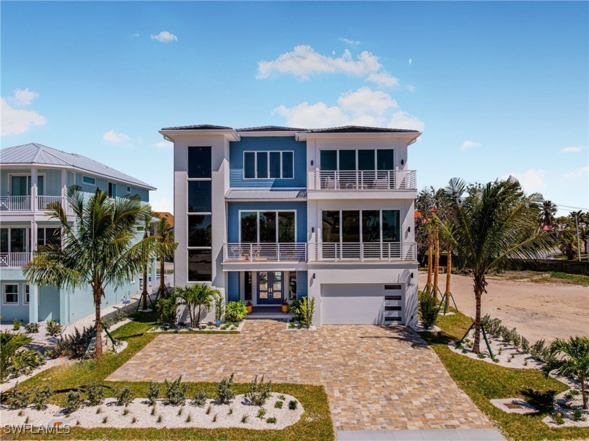 Overlooking the pristine sands of Fort Myers Beach, this BRAND - Beach Home for sale in Fort Myers Beach, Florida on Beachhouse.com