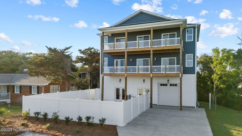 Discover the epitome of coastal living at 5806 Emerald Dr, a NEW - Beach Home for sale in Emerald Isle, North Carolina on Beachhouse.com