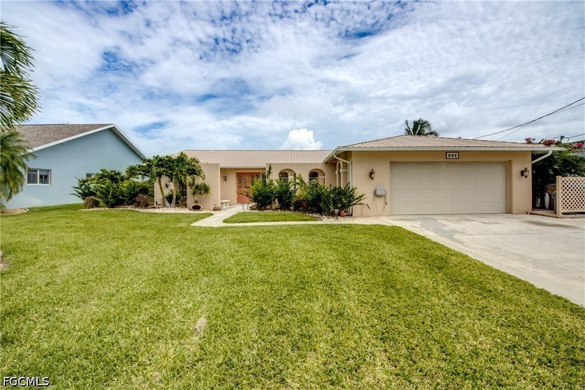 Discover this beautifully maintained freshwater canal pool home - Beach Home for sale in Cape Coral, Florida on Beachhouse.com