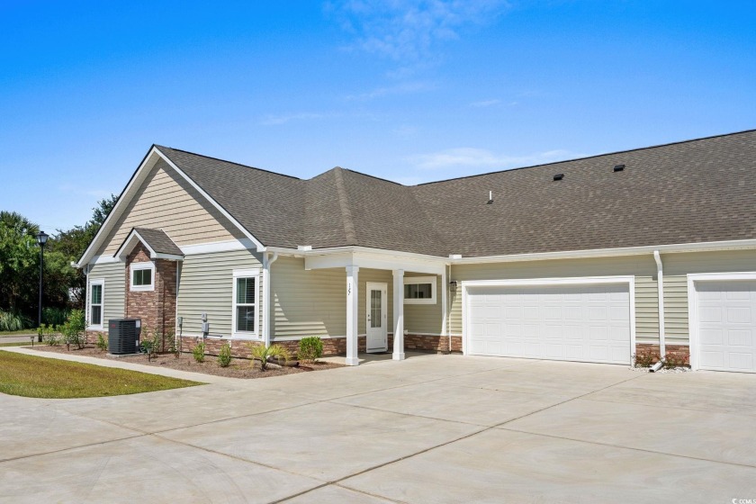 Welcome to this never-occupied, move-in ready villa offering - Beach Condo for sale in Longs, South Carolina on Beachhouse.com