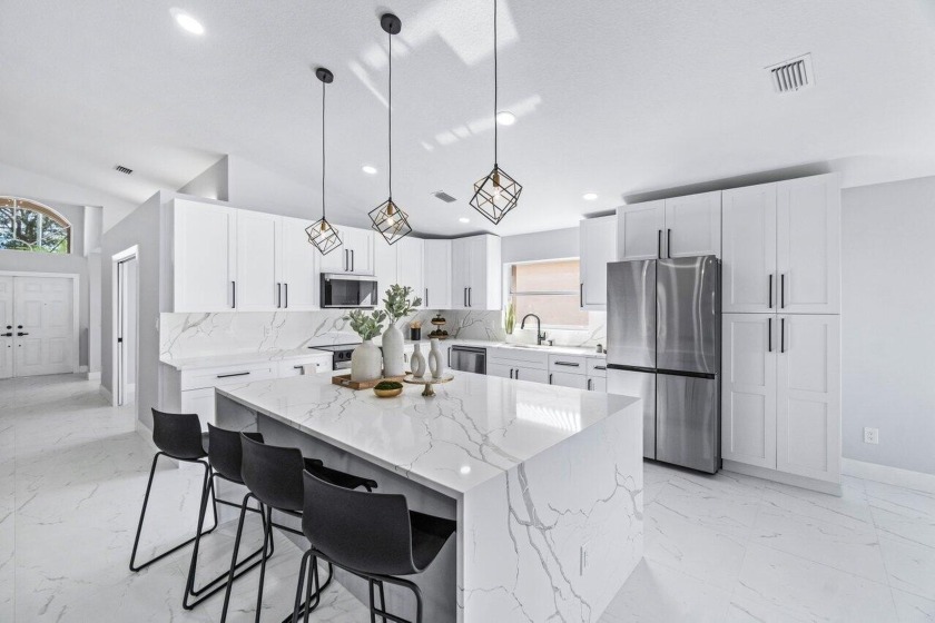 Welcome to your dream home in the picturesque Valencia Lakes! - Beach Home for sale in Boynton Beach, Florida on Beachhouse.com