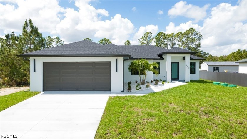 Beautiful newly constructed 3-bedroom, 2-bath home offering 1 - Beach Home for sale in Lehigh Acres, Florida on Beachhouse.com