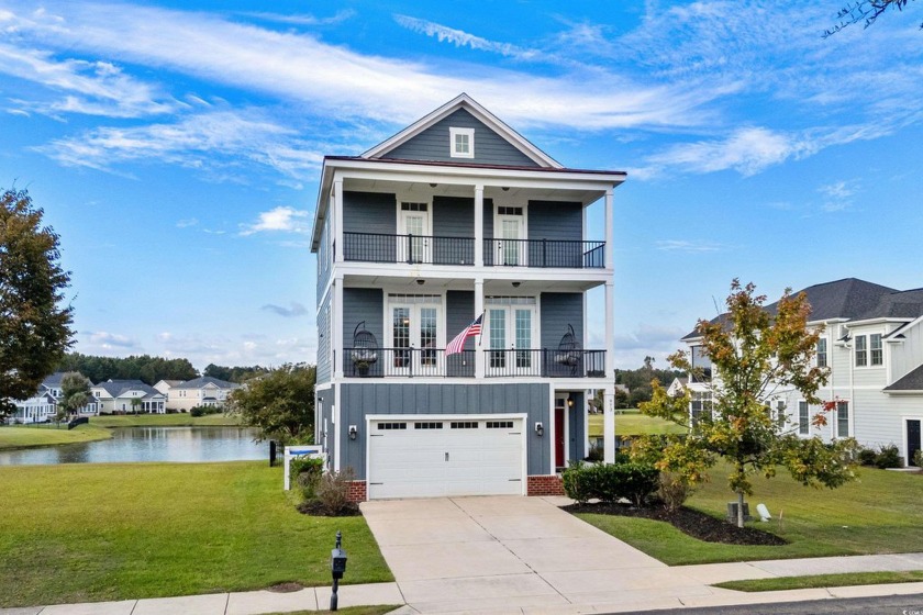 This stunning four-story home offers exceptional lake views from - Beach Home for sale in Myrtle Beach, South Carolina on Beachhouse.com