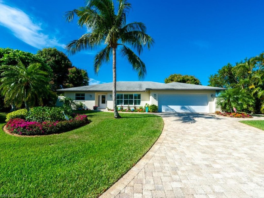 This completely updated and beautifully decorated home is - Beach Home for sale in Sanibel, Florida on Beachhouse.com