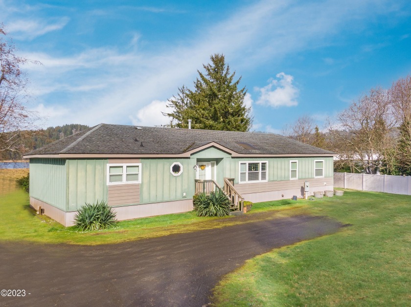 This manufactured home located on the Alsea River is sure to - Beach Home for sale in Waldport, Oregon on Beachhouse.com