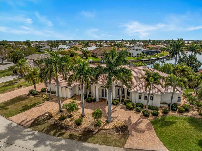 Situated on a rare double lot in the highly sought-after Punta - Beach Home for sale in Punta Gorda, Florida on Beachhouse.com