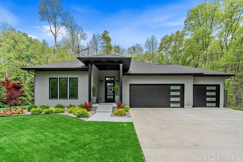 Tucked away on a beautifully wooded peninsula in Saugatuck - Beach Home for sale in Saugatuck, Michigan on Beachhouse.com