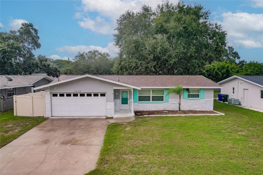 Discover Your Dunedin Oasis! This split floor plan ranch-style - Beach Home for sale in Dunedin, Florida on Beachhouse.com