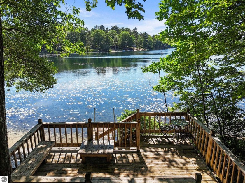 Nestled on the shores of Tibbets Lake, this charming cottage - Beach Home for sale in Traverse City, Michigan on Beachhouse.com