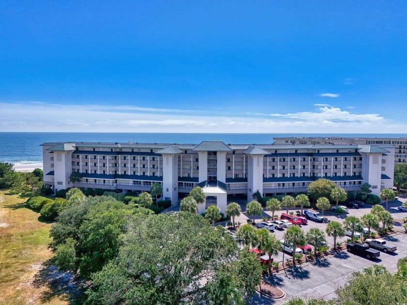 Relax in this charming oceanfront getaway, perched on the 4th - Beach Condo for sale in Pawleys Island, South Carolina on Beachhouse.com