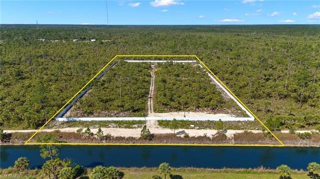 Desirable 5.24 acres. 100% UPLANDS! Canal frontpletely fenced in - Beach Acreage for sale in Naples, Florida on Beachhouse.com