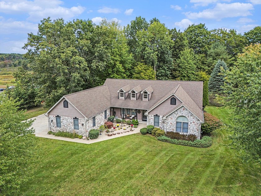 RIVERVIEW ESTATES - Nestled on a rare double corner lot, this - Beach Home for sale in Ludington, Michigan on Beachhouse.com