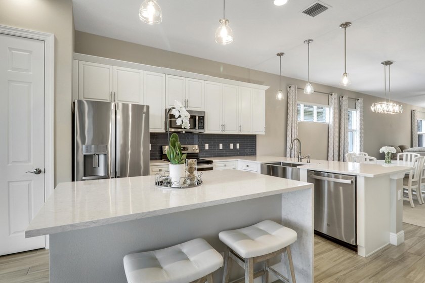 NESTLED ON A LAKEFRONT LOT and BRIMMING WITH UPGRADES, this - Beach Home for sale in Port Saint Lucie, Florida on Beachhouse.com