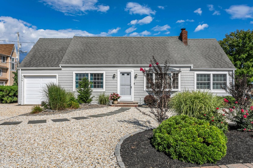 This Seashore Colonial, perfectly nestled on an oversized lot in - Beach Home for sale in Mantoloking, New Jersey on Beachhouse.com