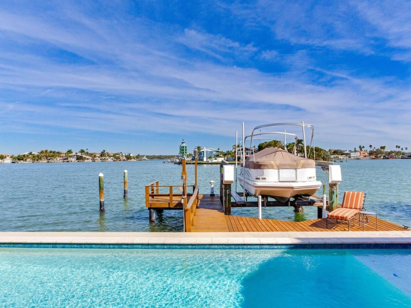 STUNNING 3 BEDROOM POOL HOME WITH 75 FT OF WATERFRONT HIGH AND - Beach Home for sale in Redington Beach, Florida on Beachhouse.com