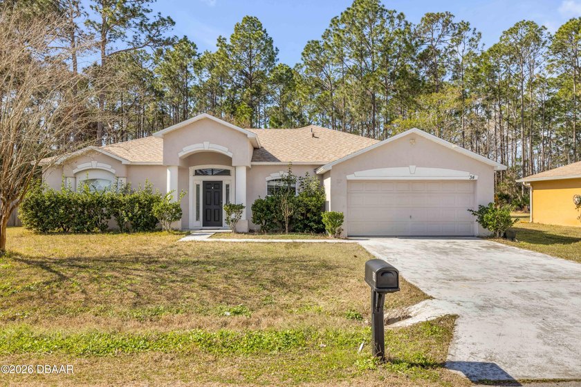 Discover this beautifully maintained 3-bedroom, 2-bathroom home - Beach Home for sale in Palm Coast, Florida on Beachhouse.com