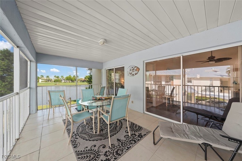 SUNLIGHT POURS IN OFF THE GLISTENING LAKE. Second floor end unit - Beach Condo for sale in Fort Myers, Florida on Beachhouse.com