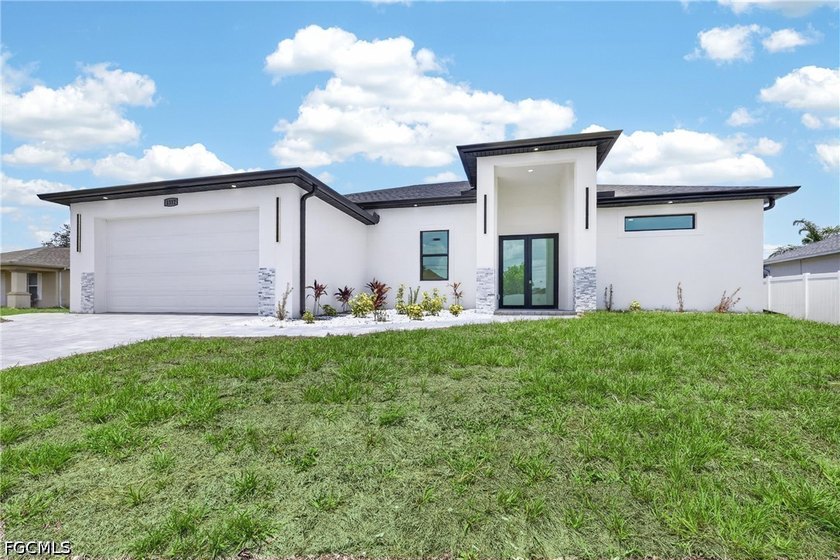 Welcome to this stunning new construction home located in the - Beach Home for sale in Cape Coral, Florida on Beachhouse.com