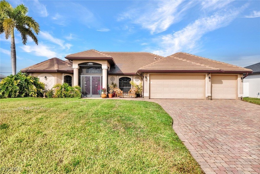 Welcome to this impeccably maintained 4-bedroom, 2-bath, 3-car - Beach Home for sale in Cape Coral, Florida on Beachhouse.com