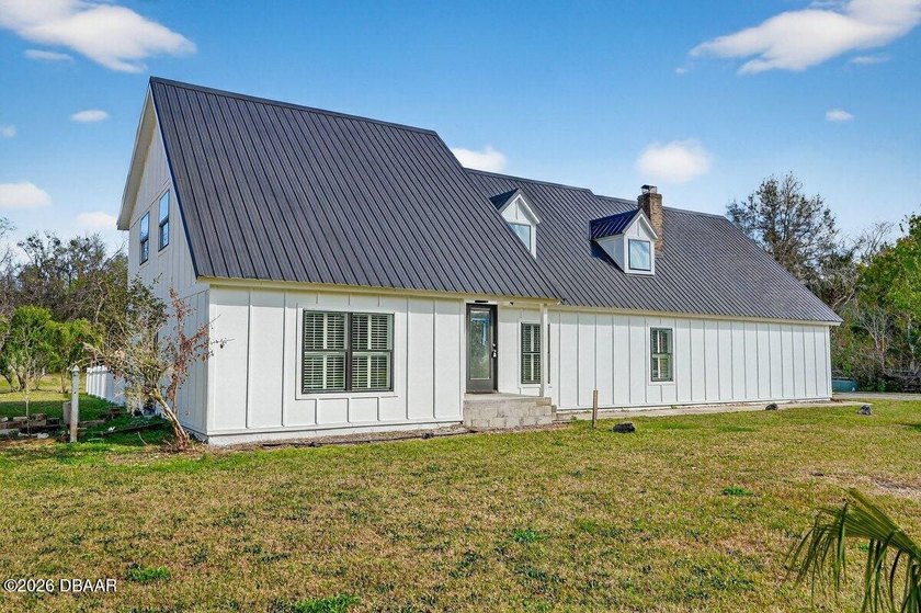 Nestled on a sprawling 1.35-acre estate lot in one of Port - Beach Home for sale in Port Orange, Florida on Beachhouse.com