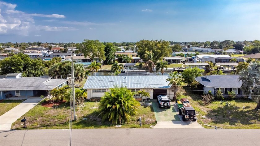 Don't miss this 3-bedroom, 2-bath canal-front home in a - Beach Home for sale in Port Charlotte, Florida on Beachhouse.com