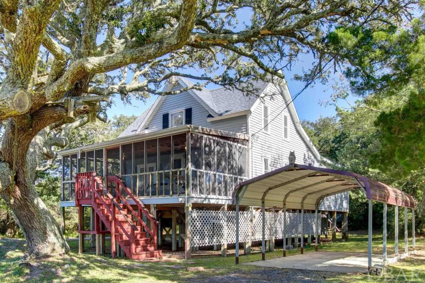 Come see this cozy cottage nestled in the Live Oaks of Avon - Beach Home for sale in Avon, North Carolina on Beachhouse.com