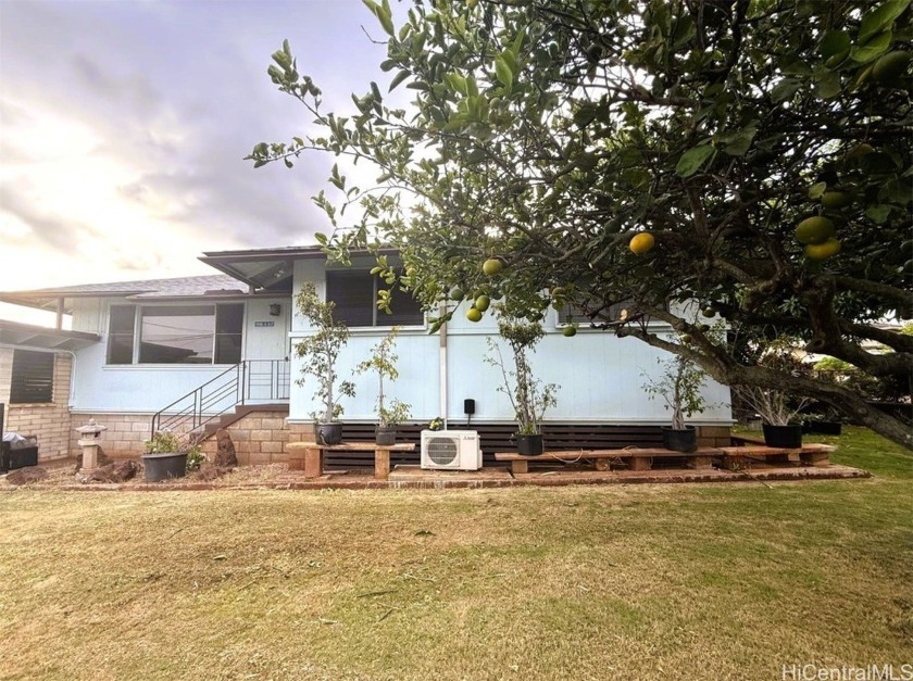 Nestled on a tranquil corner lot, this house offers the perfect - Beach Home for sale in Pearl City, Hawaii on Beachhouse.com