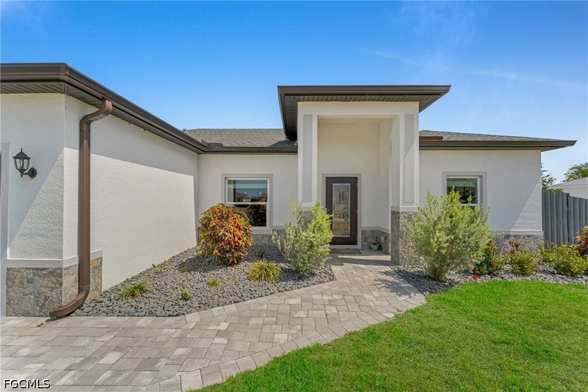 Beautiful 2023-built home in Cape Coral featuring impact windows - Beach Home for sale in Cape Coral, Florida on Beachhouse.com