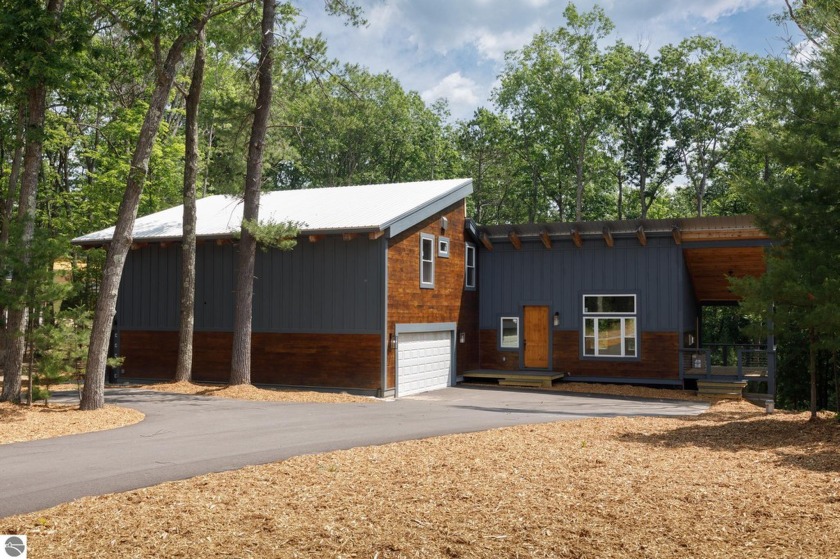 Contemporary design paired with rustic details create this - Beach Home for sale in Traverse City, Michigan on Beachhouse.com