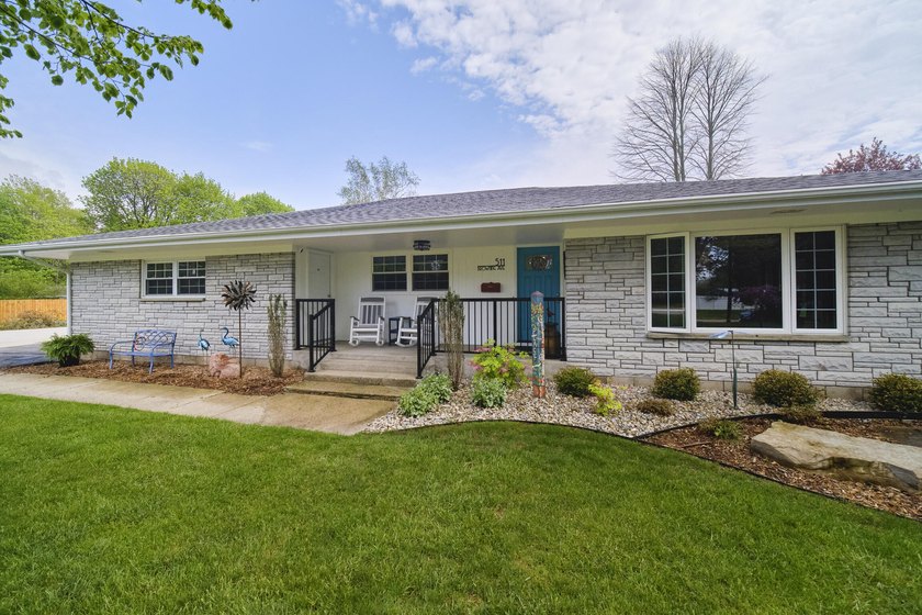 This beautifully updated 3-bedroom, 2-bath ranch offers modern - Beach Home for sale in Manistee, Michigan on Beachhouse.com