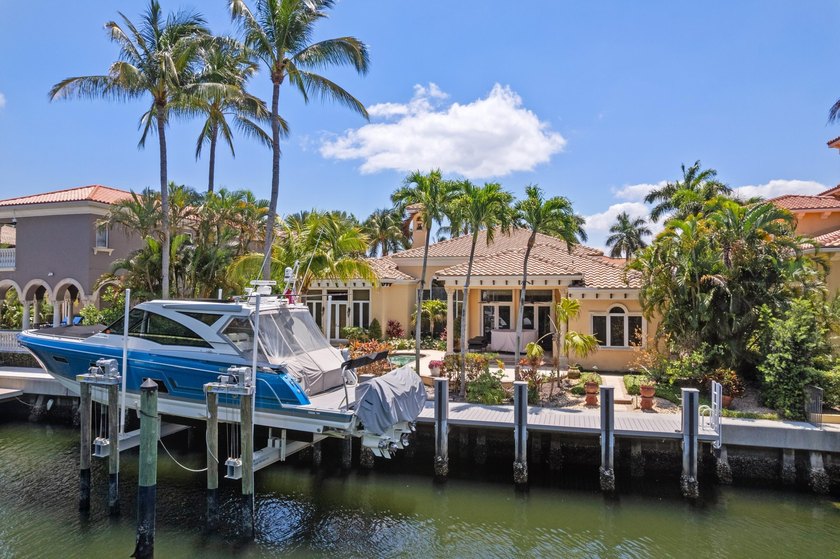 Positioned behind the gates of Harbour Isles, this stunning - Beach Home for sale in North Palm Beach, Florida on Beachhouse.com