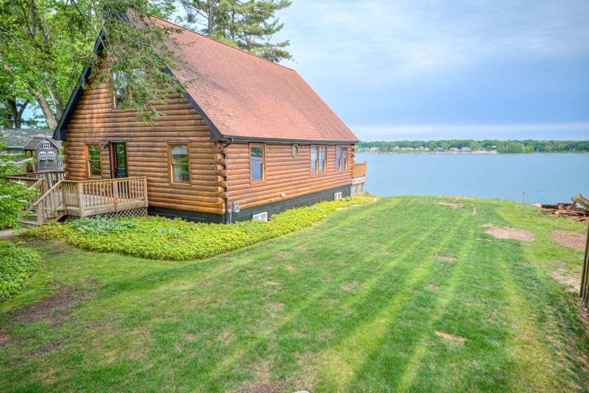 Escape to the serene beauty of lakefront living in this - Beach Home for sale in Muskegon, Michigan on Beachhouse.com