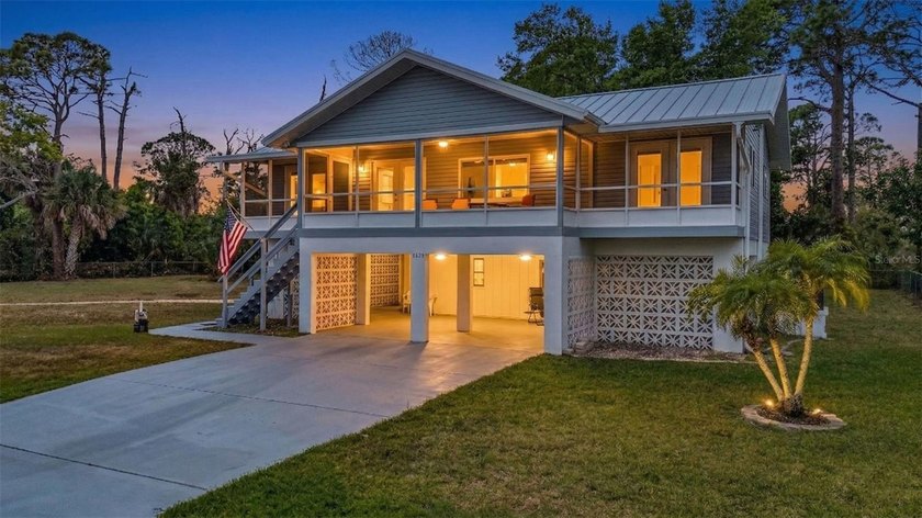 This lovely 3-bedroom, 3-bath home is perfectly situated on a - Beach Home for sale in Port Charlotte, Florida on Beachhouse.com