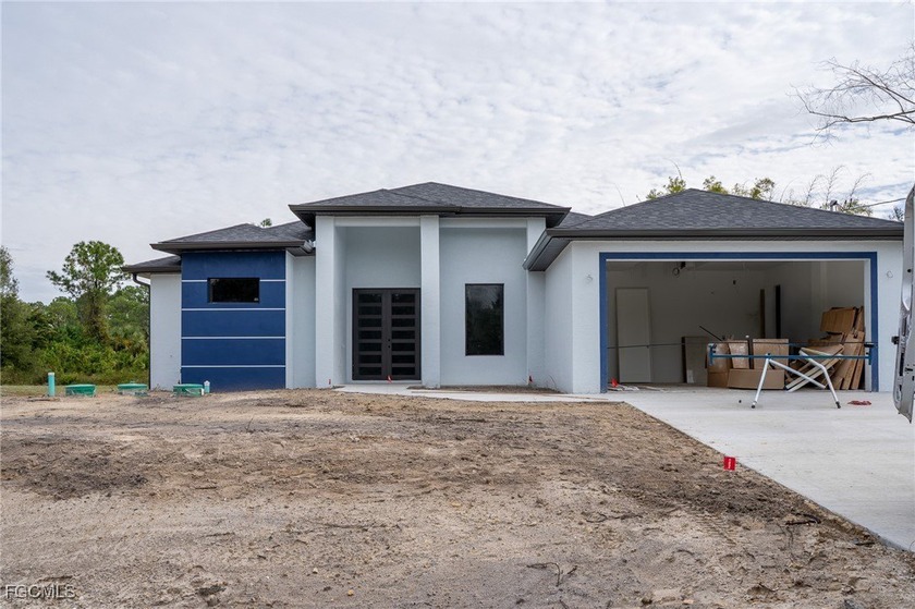 HALF ACRE. Beautiful new home in Lehigh Acres featuring soaring - Beach Home for sale in Lehigh Acres, Florida on Beachhouse.com