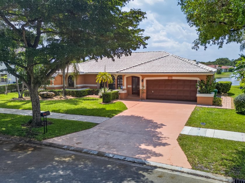 Stunning 4-bedroom, 3-bath home where style, comfort, and - Beach Home for sale in Coral Springs, Florida on Beachhouse.com