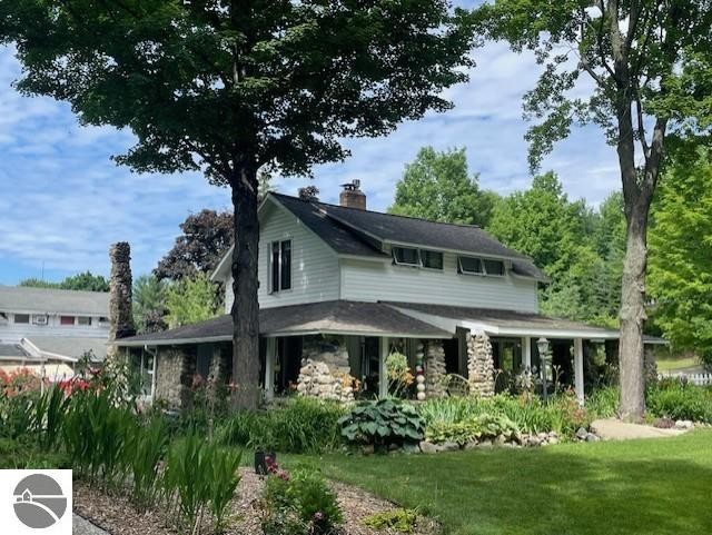 Charming historic farmhouse located just a 5 minute walk from - Beach Home for sale in Alden, Michigan on Beachhouse.com