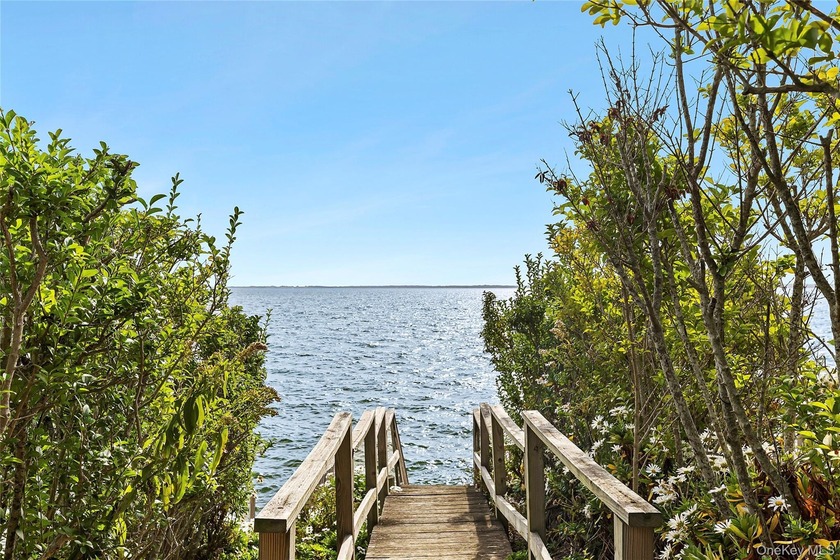 Here's your opportunity to own a charming beach cottage nestled - Beach Home for sale in Laurel, New York on Beachhouse.com