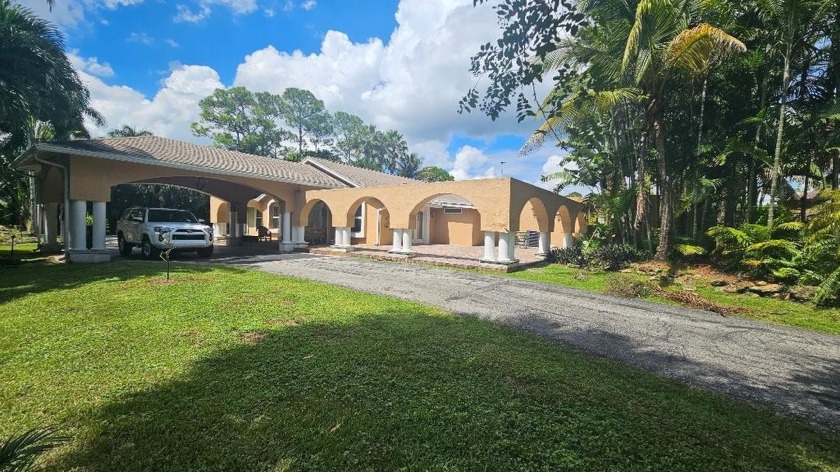 Welcome to your private paradise! Nestled on a sprawling 1 - Beach Home for sale in West Palm Beach, Florida on Beachhouse.com