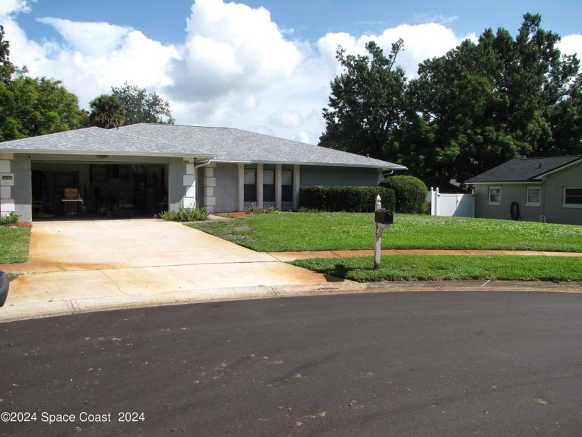 Move in ready pool home with a 2 car garage at the end of a cul - Beach Home for sale in Titusville, Florida on Beachhouse.com