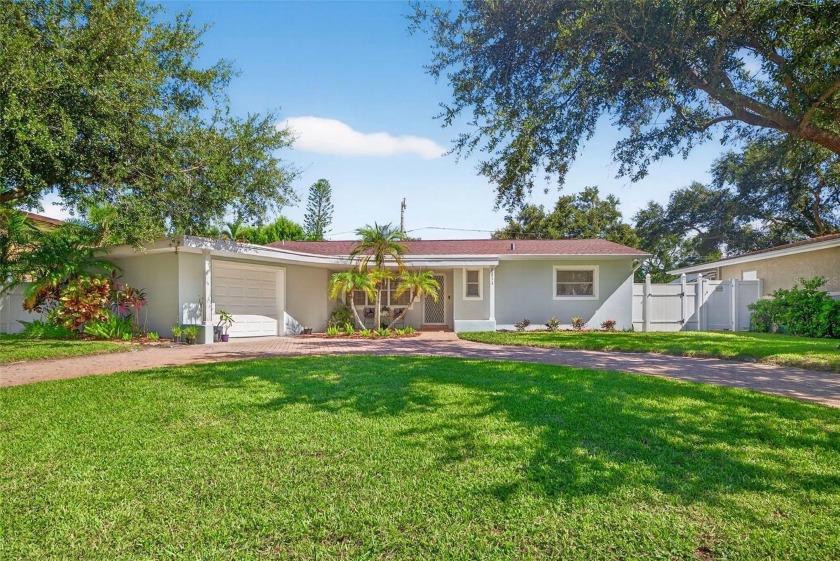 Welcome to this charming full-block home in the highly - Beach Home for sale in St. Petersburg, Florida on Beachhouse.com