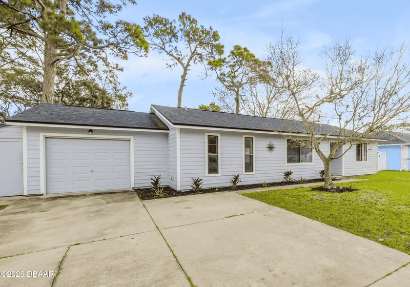 Welcome home to this inviting 3 bedroom, 2 bath home with an - Beach Home for sale in Edgewater, Florida on Beachhouse.com