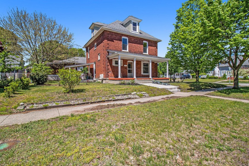City of Ludington-Discover this charming three-story brick home - Beach Home for sale in Ludington, Michigan on Beachhouse.com