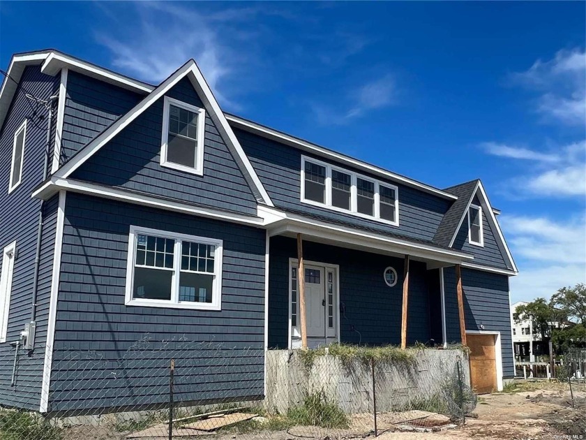 One of Two Magnificent Brand New Waterfront Colonials Being - Beach Home for sale in Oceanside, New York on Beachhouse.com