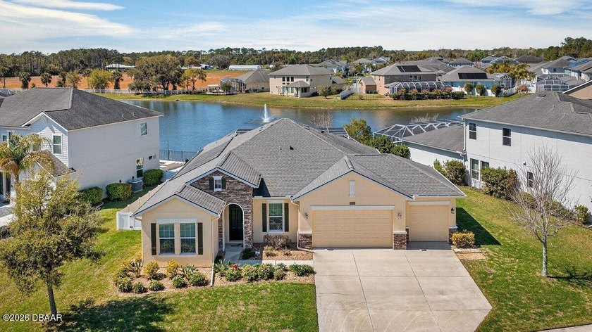 THIS GORGEOUS SINGLE STORY LAKEFRONT POOL HOME, LOCATED IN THE - Beach Home for sale in Port Orange, Florida on Beachhouse.com