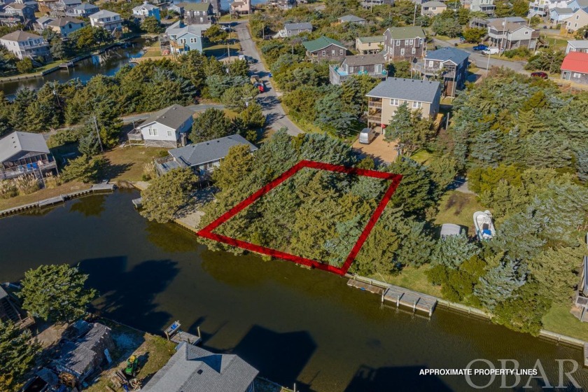 Nestled in the serene Hatteras Colony subdivision, this canal - Beach Lot for sale in Avon, North Carolina on Beachhouse.com